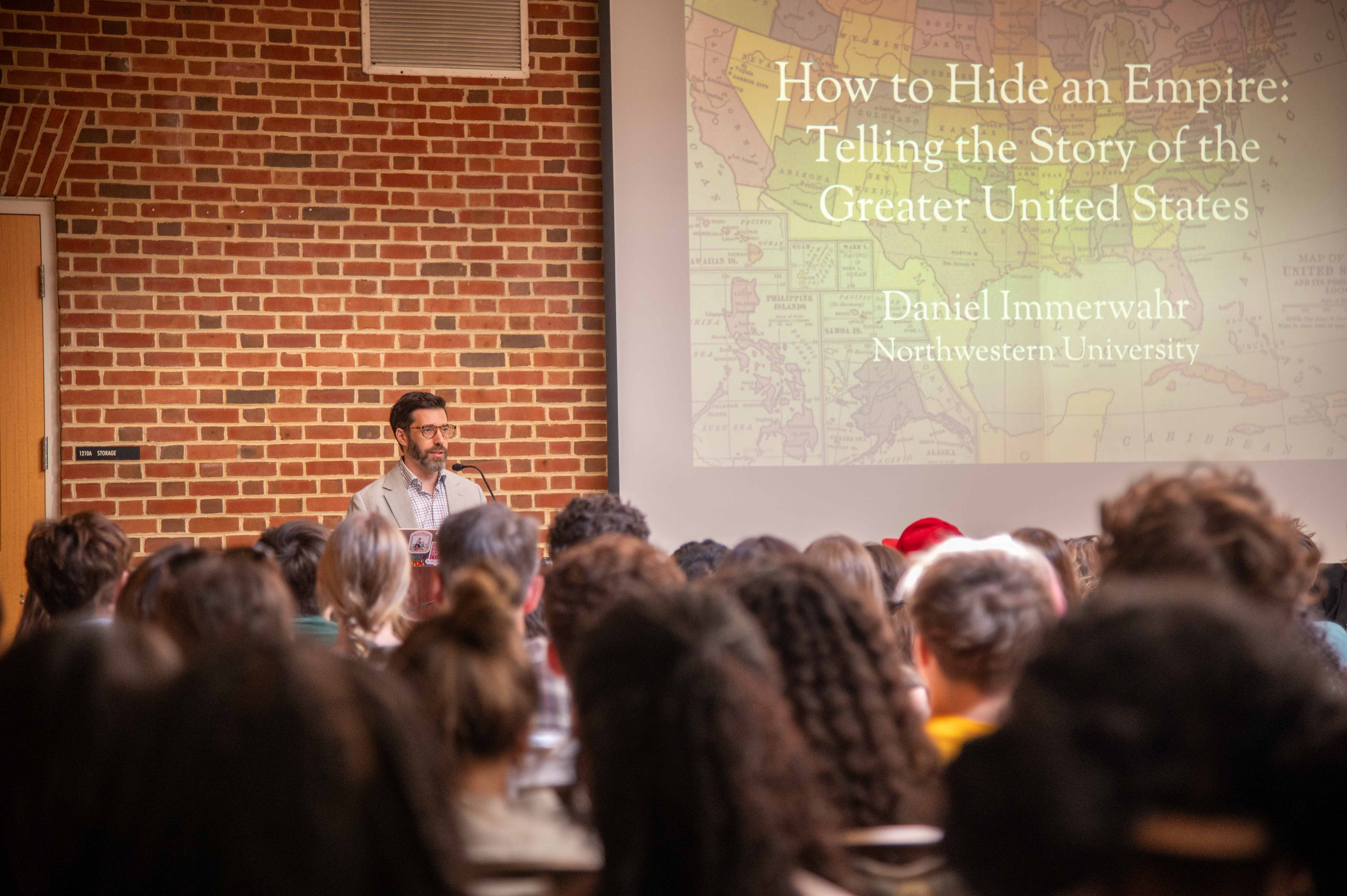Daniel Immerwahr preparing to give his presentation to an audience of students and faculty