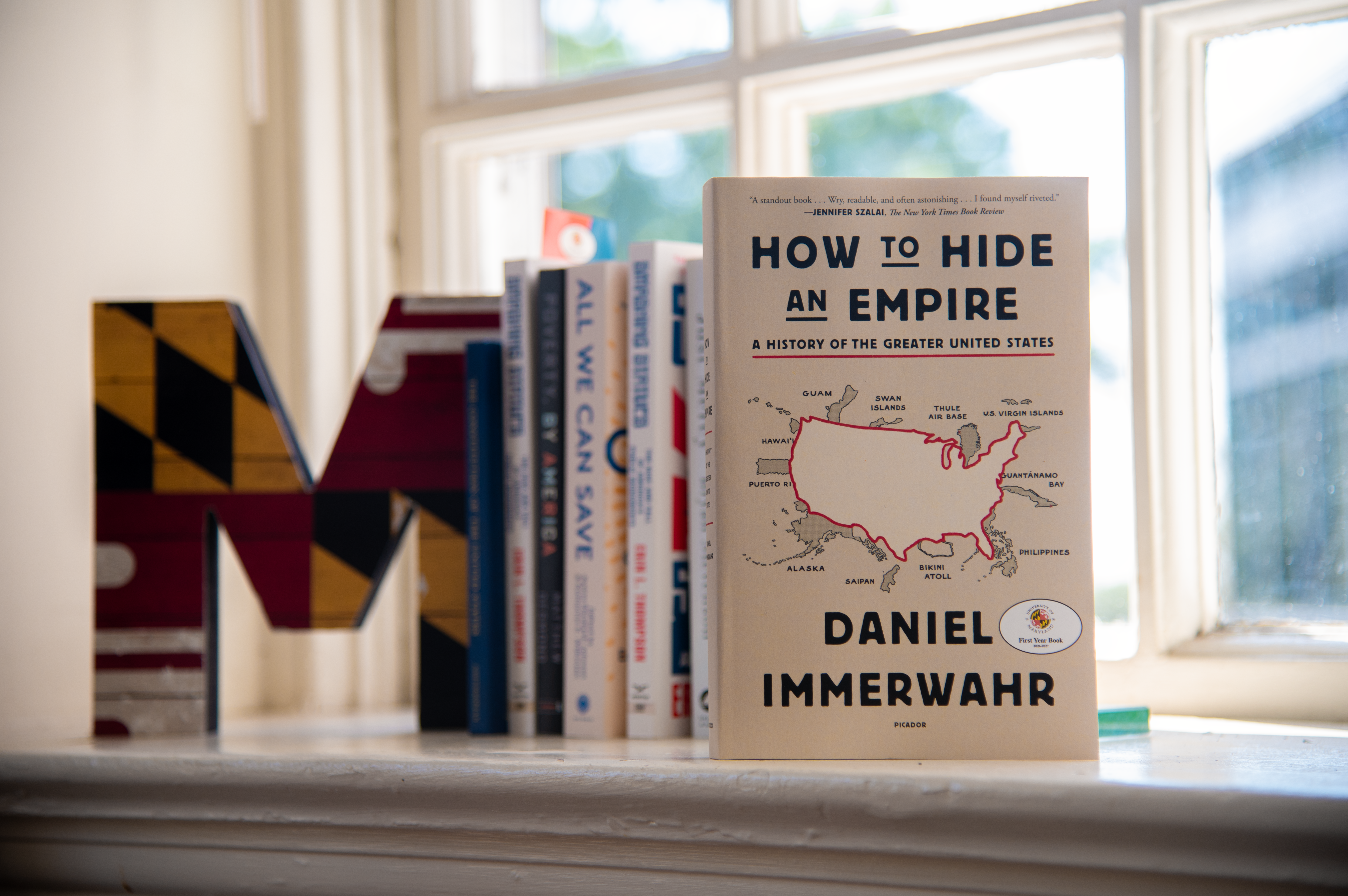 How to Hide an Empire book on window with other books